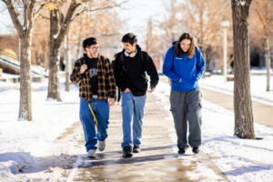 students walking together and smiling on the MSU Denver campus